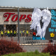 Investigators stand outside during a moment of silence for the victims of the Buffalo supermarket shooting outside the Tops Friendly Market on Saturday, May 21, 2022, in Buffalo, N.Y.
